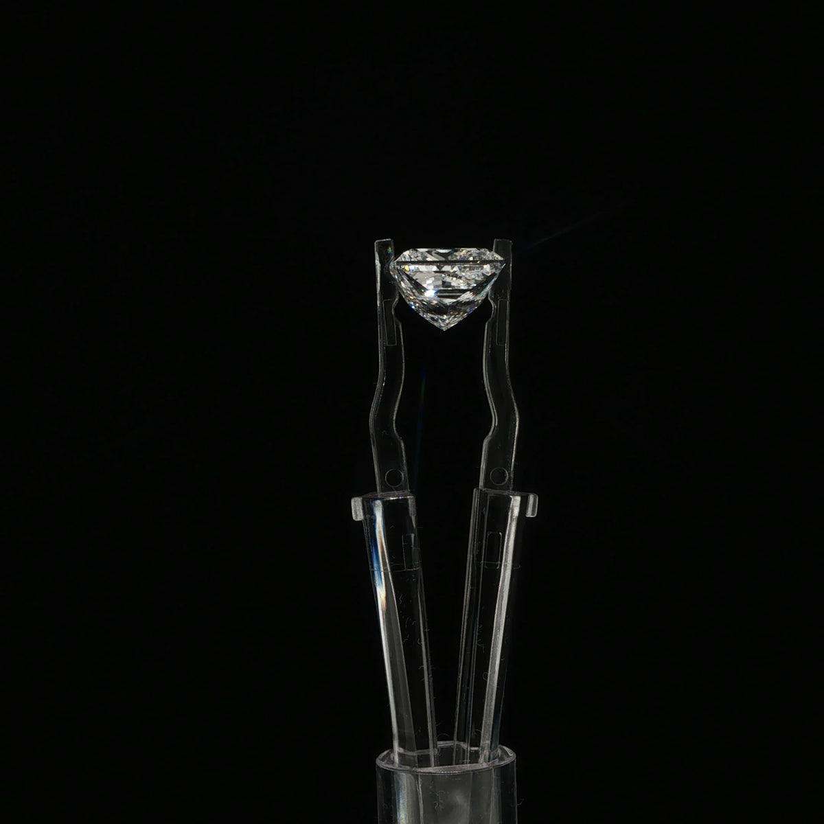 Loose Diamond in Tweezers