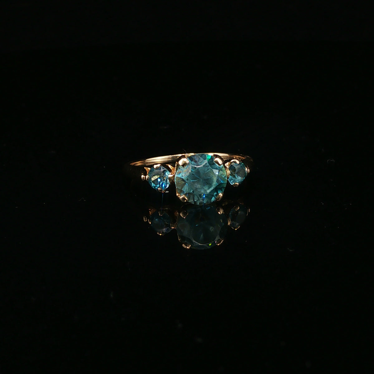 Blue Topaz Three-Stone Ring in Yellow Gold