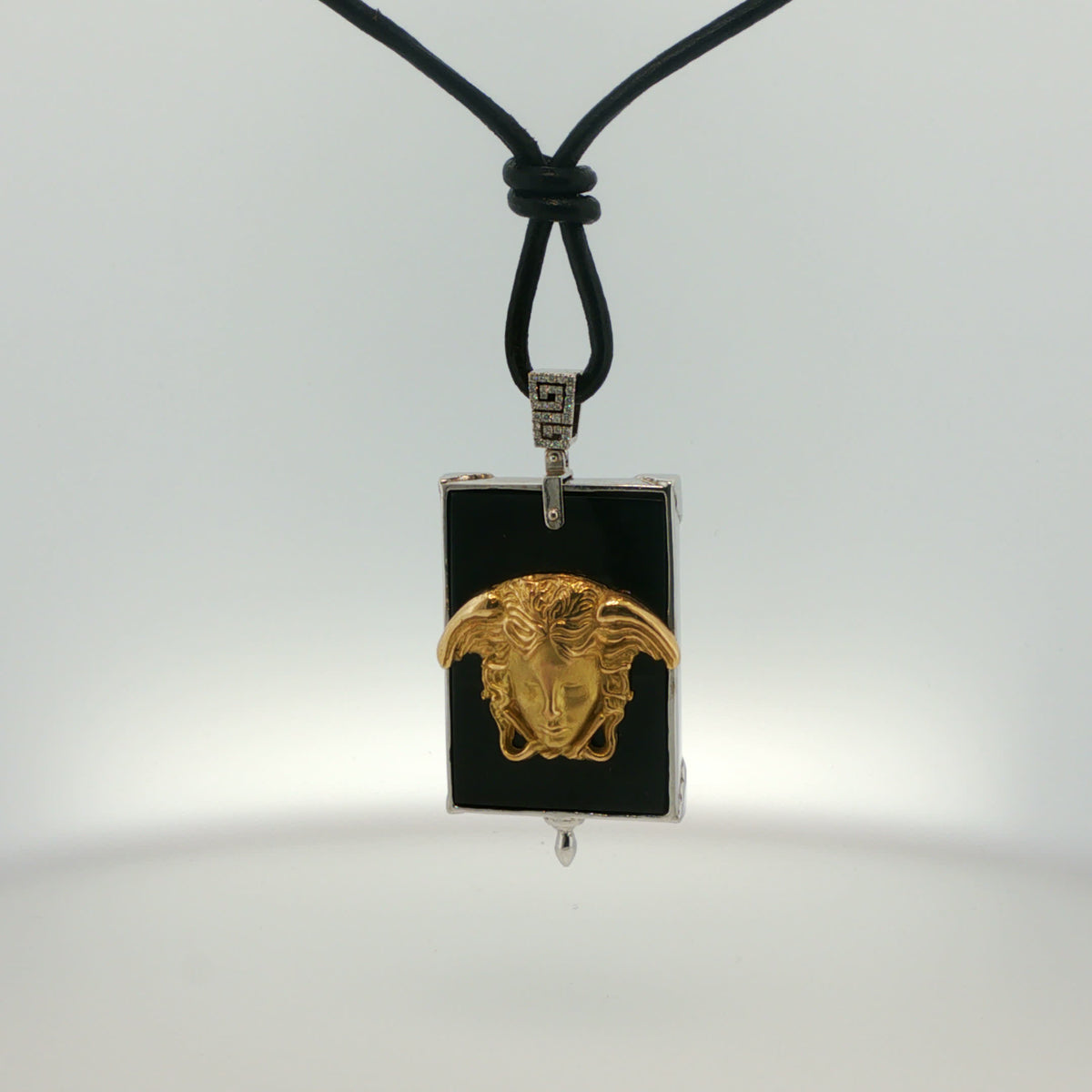 White Gold Onyx Charm Necklace with Sculpted Face Motif