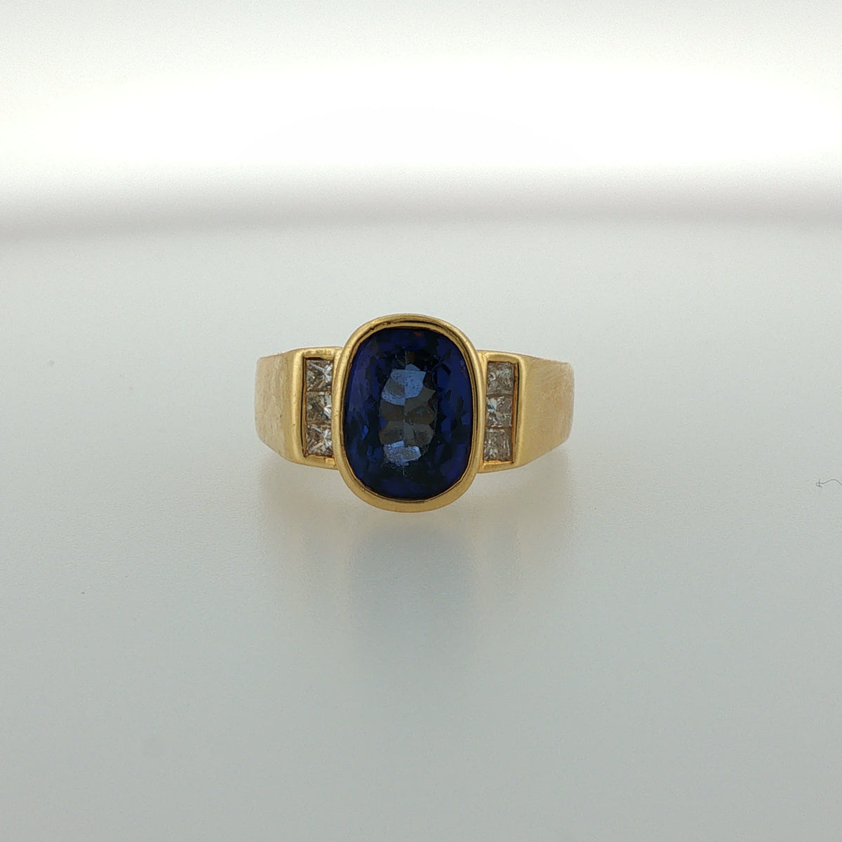 Bezel-Set Royal Blue Sapphire Ring in Yellow Gold