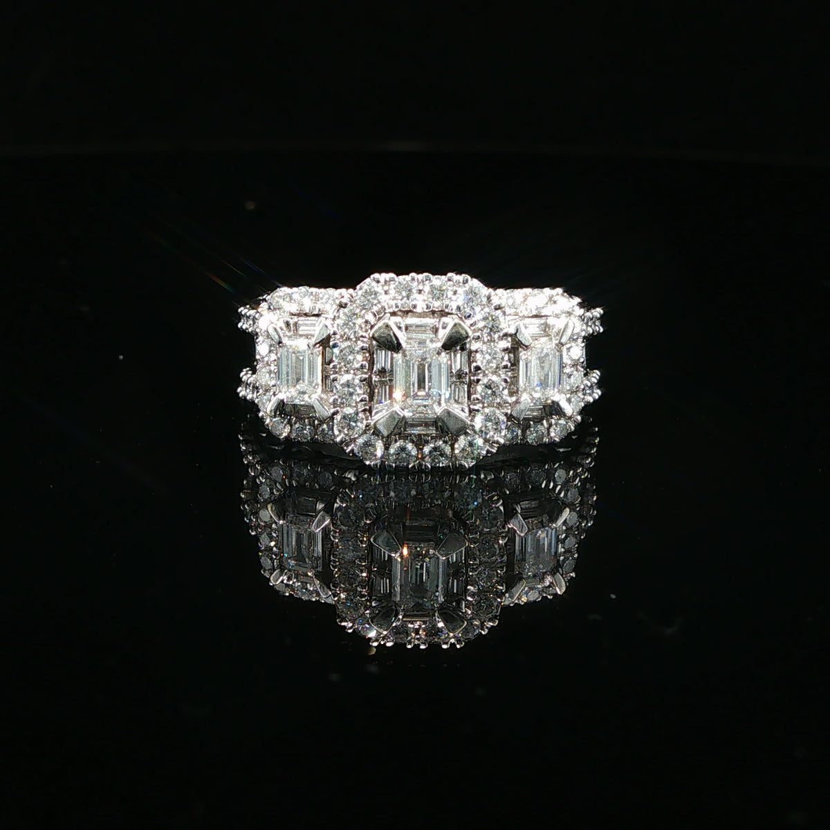 Triple Emerald-Cut Diamond Halo Ring in White Gold