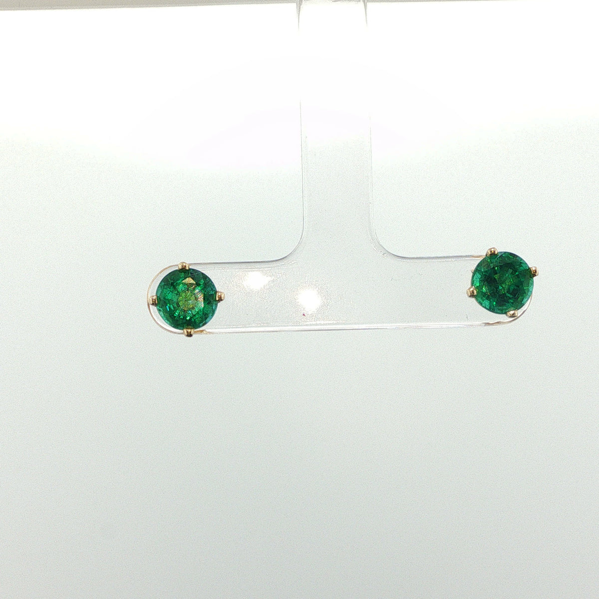 Round Emerald Four-Prong Stud Earrings in Yellow Gold
