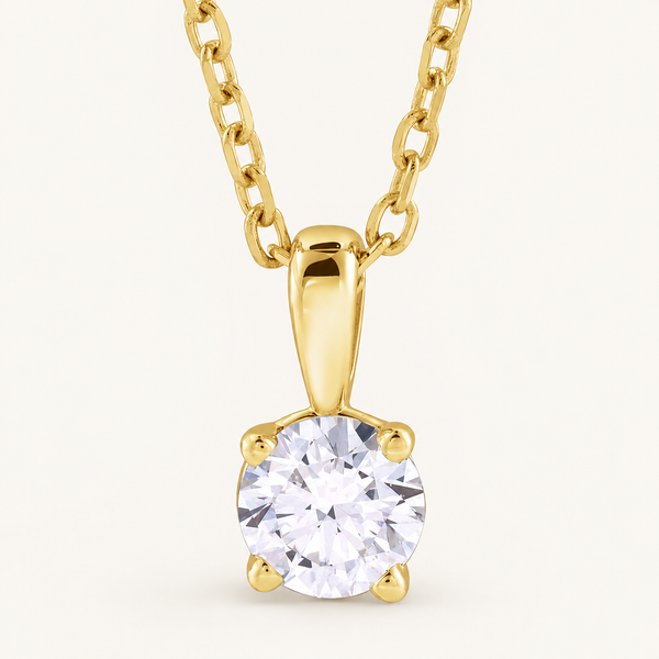 14K Yellow Gold 1/2 CT Lab-Grown Diamond Solitaire Necklace on an ivory background