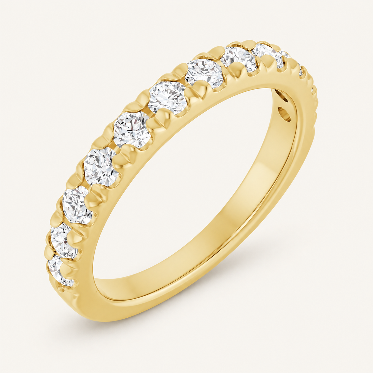 14K Yellow Gold 3/4 CTW Lab-Grown Diamond Anniversary Band on an ivory background