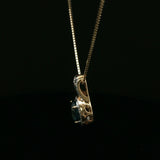 Oval Blue Topaz Halo Pendant Necklace in Yellow Gold