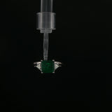 Emerald and Trillion Diamond Three-Stone Ring in White Gold