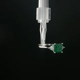 Emerald and Trillion Diamond Three-Stone Ring in White Gold