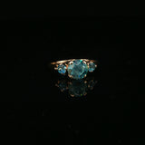 Blue Topaz Three-Stone Ring in Yellow Gold