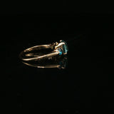Blue Topaz Three-Stone Ring in Yellow Gold
