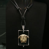 White Gold and Onyx Medusa Charm Necklace