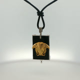 White Gold Onyx Charm Necklace with Sculpted Face Motif