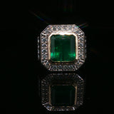 Emerald Cut Emerald and White Gold Halo Cocktail Ring