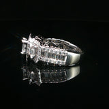 Triple Emerald-Cut Diamond Halo Ring in White Gold