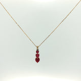 Three-Stone Heart Ruby Pendant Necklace in Yellow Gold