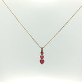 Three-Stone Heart Ruby Pendant Necklace in Yellow Gold