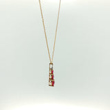 Three-Stone Heart Ruby Pendant Necklace in Yellow Gold