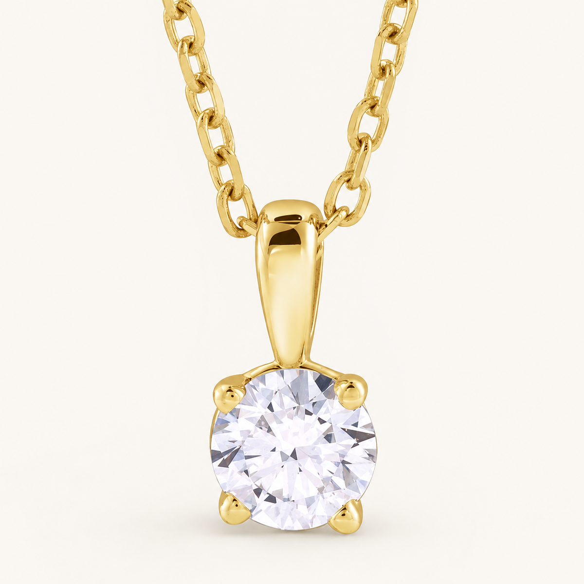 14K Yellow Gold 1/2 CT Lab-Grown Diamond Solitaire Necklace on an ivory background